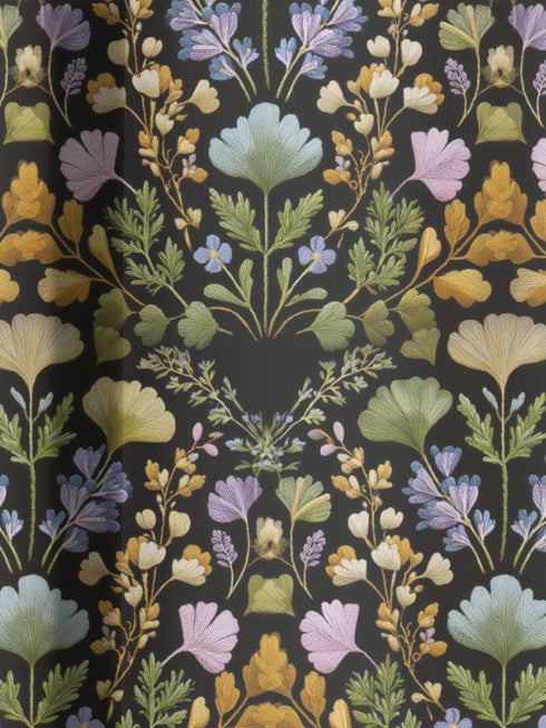 Luxury blackout curtain panel featuring a dark background with a symmetrical botanical pattern of embroidered-style wildflowers in muted pastel and golden tones. The curtain has a rich satiny texture and a 4-inch rod pocket top. Printed on one side, white backing.